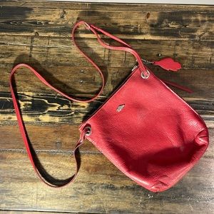 Roots pebbled leather red purse with long crossbody strap. Made in Canada